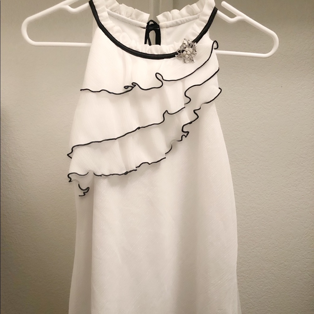 Swirly black and white blouse with jewel and laces